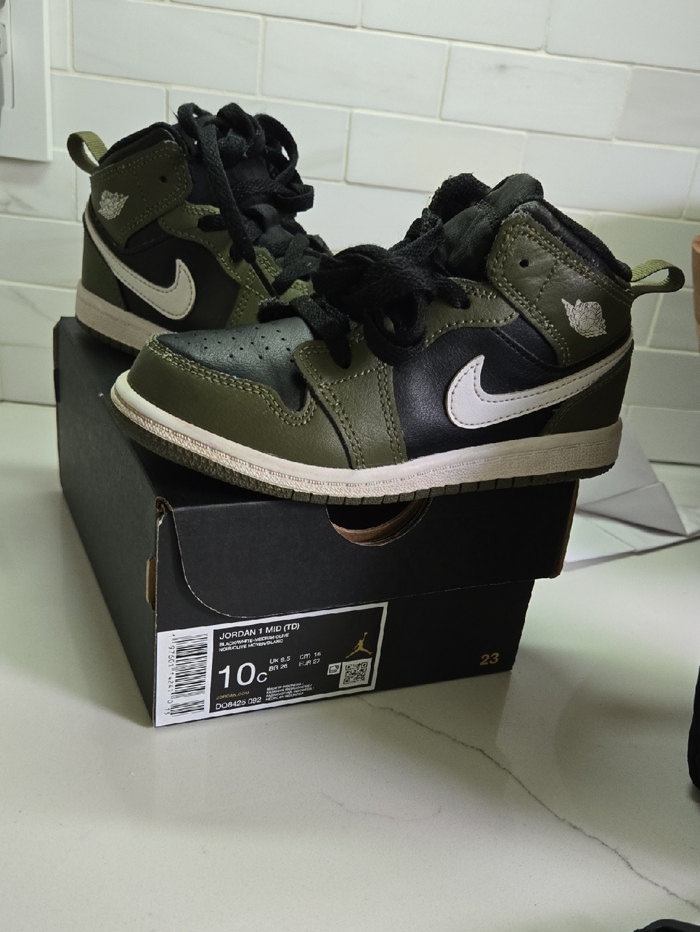 Jordan 1 Kids Mid-Top Sneakers in Olive Green, Black, and White